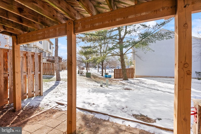 view of yard layered in snow