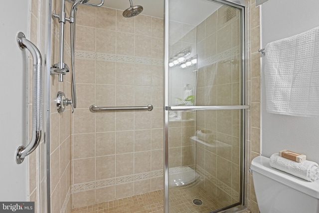 bathroom with toilet and walk in shower