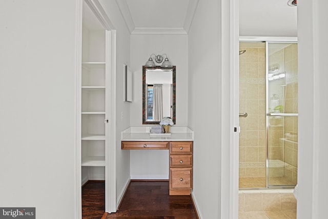 bathroom featuring crown molding, hardwood / wood-style floors, vanity, and an enclosed shower