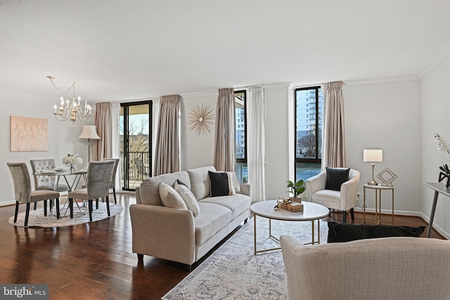 living room with floor to ceiling windows, crown molding, dark wood-type flooring, and an inviting chandelier