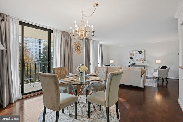 dining space featuring a notable chandelier, floor to ceiling windows, dark hardwood / wood-style flooring, and ornamental molding