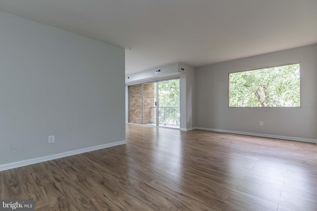 empty room featuring wood-type flooring