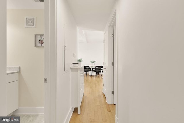 hallway with light wood-type flooring