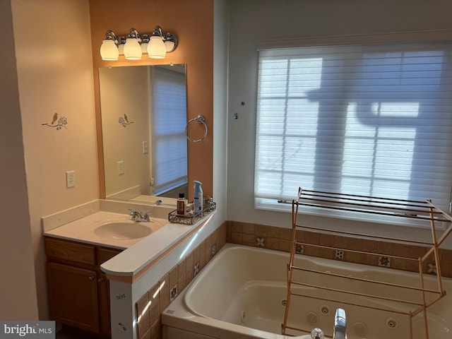 bathroom featuring vanity and a bath