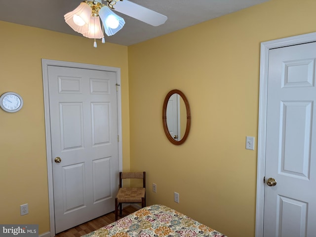 bedroom featuring hardwood / wood-style floors and ceiling fan