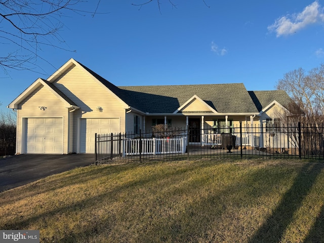 single story home with a front yard and a garage