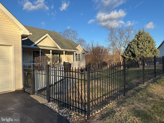 view of gate with a porch