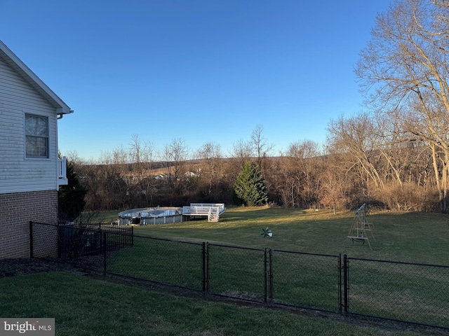 view of yard featuring a covered pool