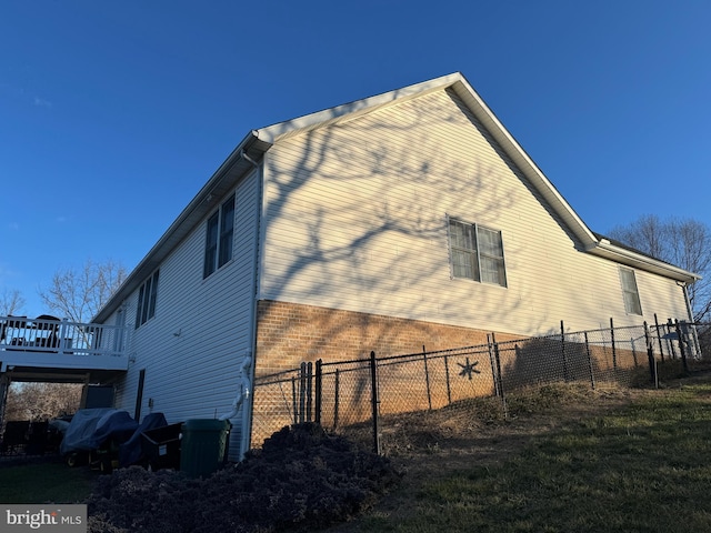 view of property exterior with a deck