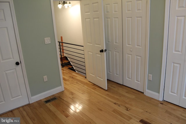 unfurnished bedroom featuring light wood-type flooring