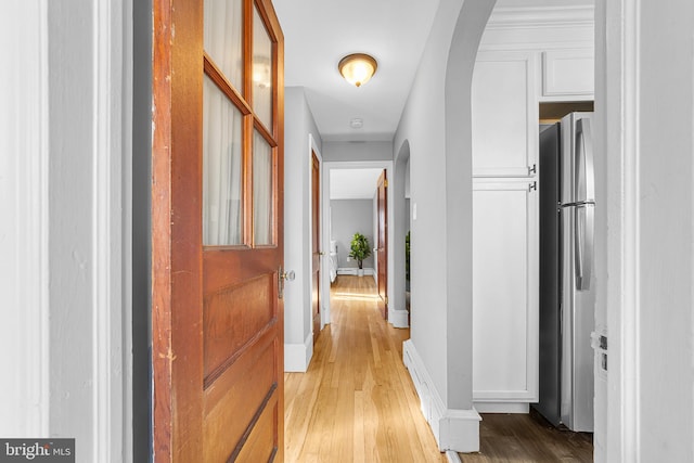 hall with light hardwood / wood-style flooring