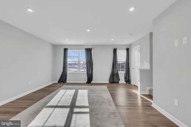 spare room with dark wood-type flooring