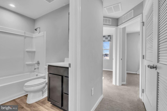 full bathroom featuring vanity, toilet, and  shower combination