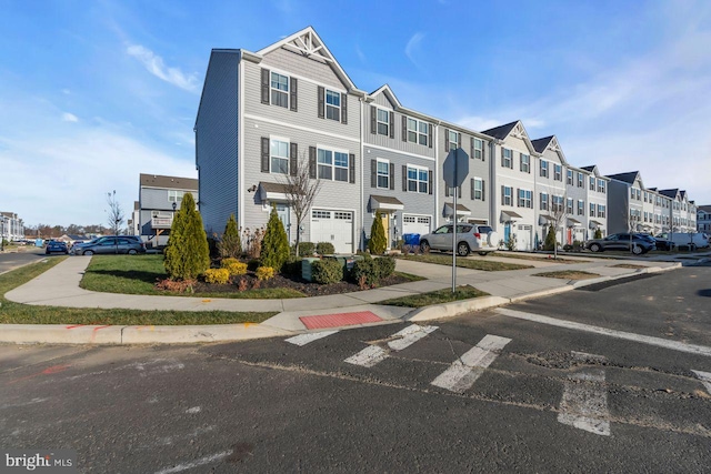 townhome / multi-family property featuring a garage