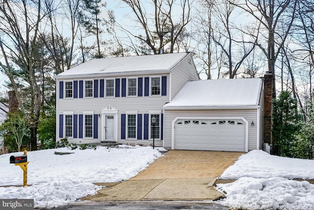 colonial inspired home with a garage