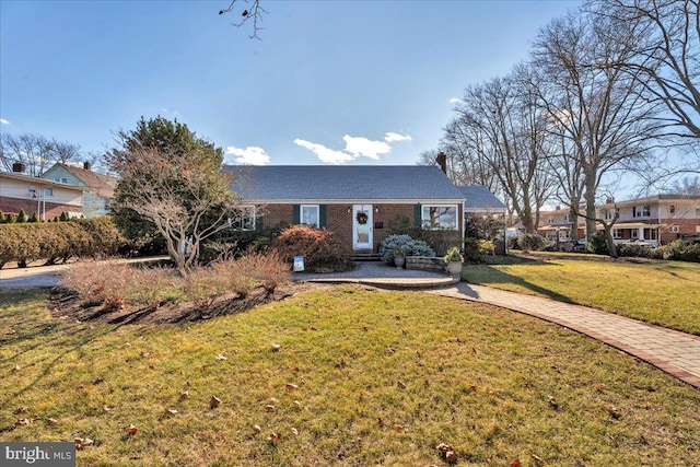 ranch-style house featuring a front lawn