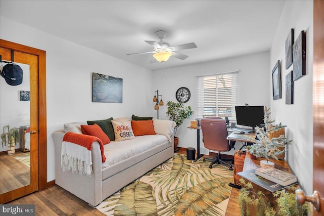 home office with ceiling fan and hardwood / wood-style floors