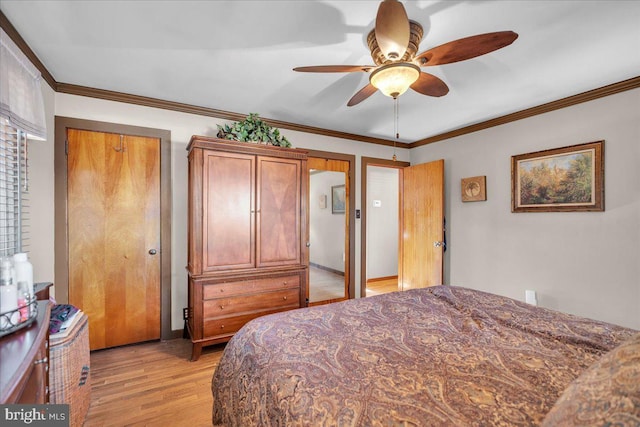 bedroom with light wood-type flooring, ceiling fan, and ornamental molding