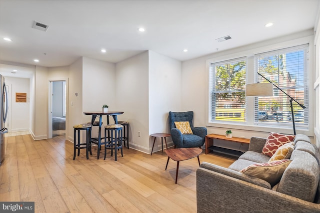 sitting room featuring light hardwood / wood-style flooring