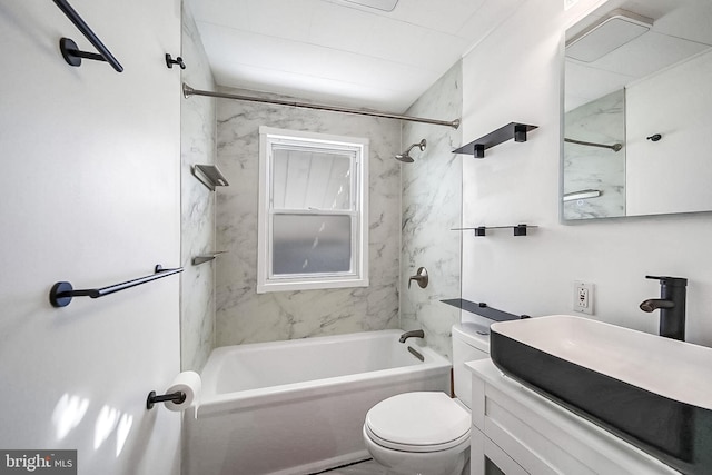 full bathroom featuring vanity, tiled shower / bath combo, and toilet