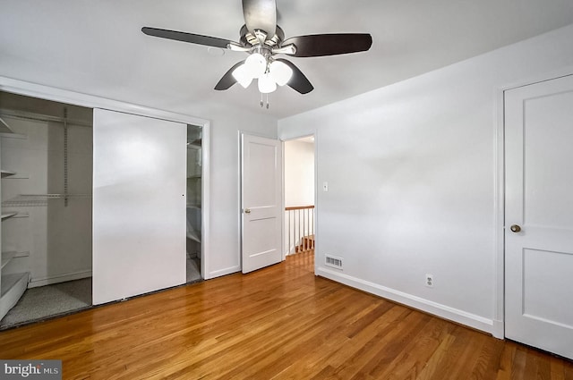 unfurnished bedroom featuring light hardwood / wood-style flooring and ceiling fan