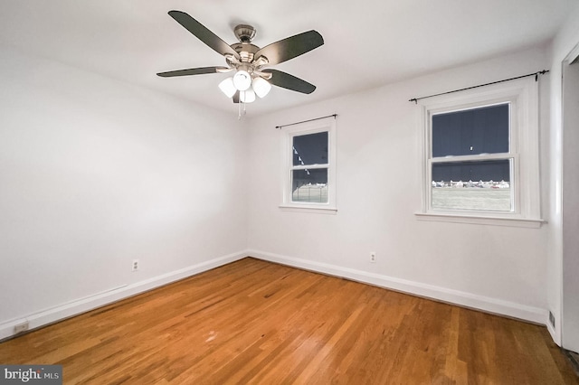 empty room featuring ceiling fan and wood-type flooring