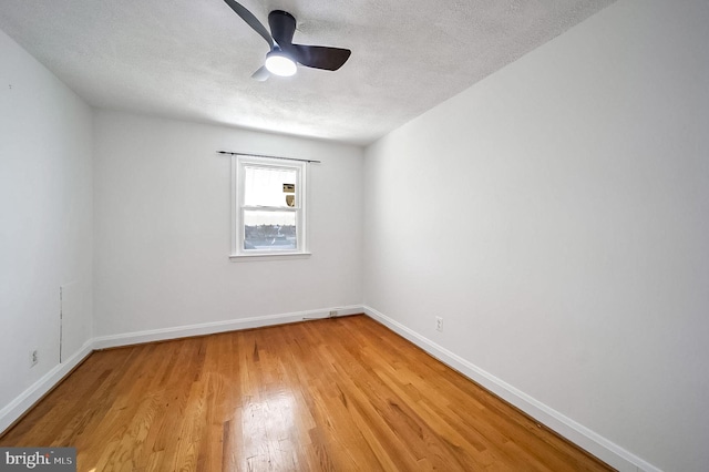 unfurnished room featuring ceiling fan, a textured ceiling, and light hardwood / wood-style flooring