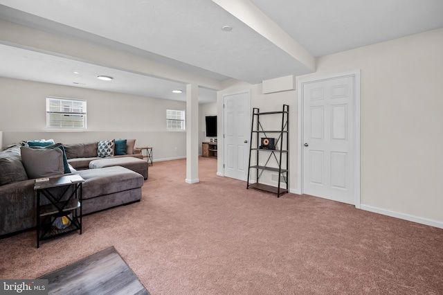 carpeted living room featuring plenty of natural light