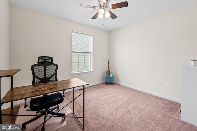 carpeted office featuring ceiling fan