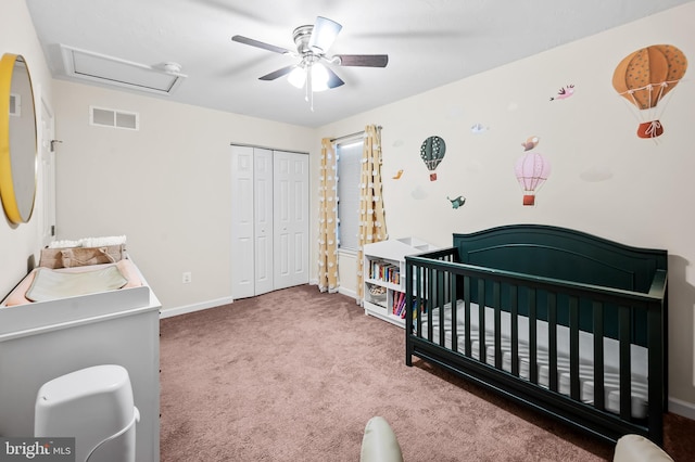 bedroom featuring ceiling fan, carpet flooring, a closet, and a crib