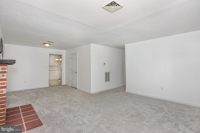 unfurnished living room featuring carpet