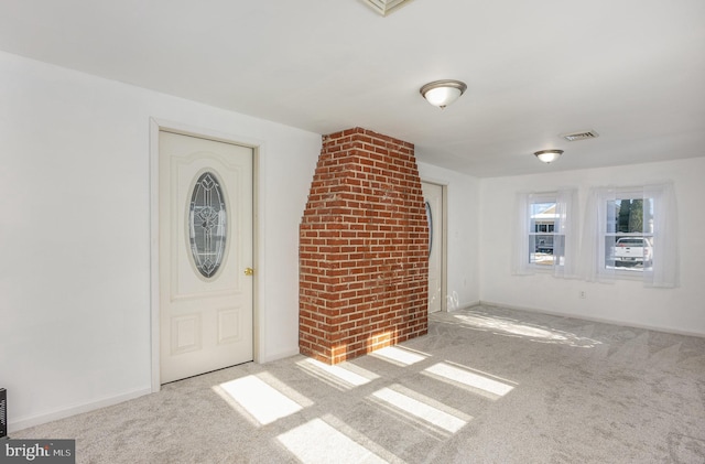 view of carpeted entrance foyer