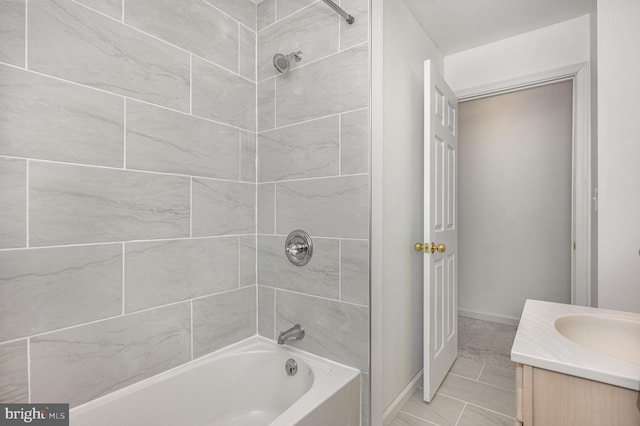 bathroom featuring vanity and tiled shower / bath combo