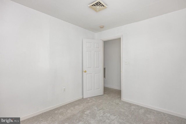 empty room with light colored carpet