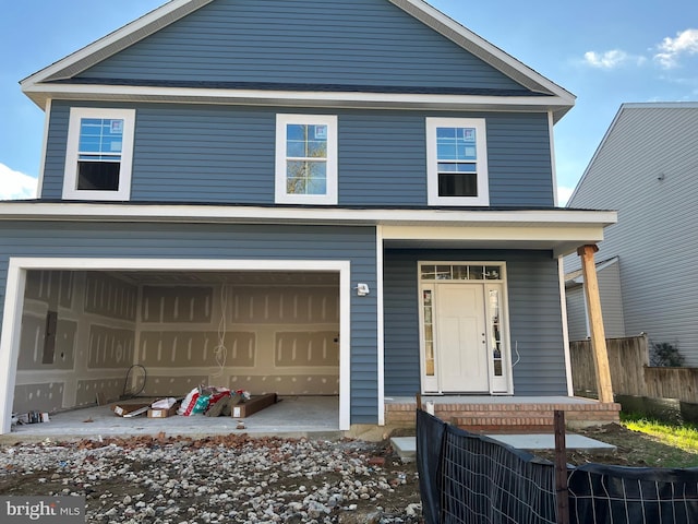 view of front of property featuring covered porch and an attached garage