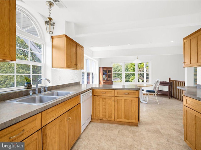 kitchen featuring dishwasher, sink, decorative light fixtures, beam ceiling, and kitchen peninsula