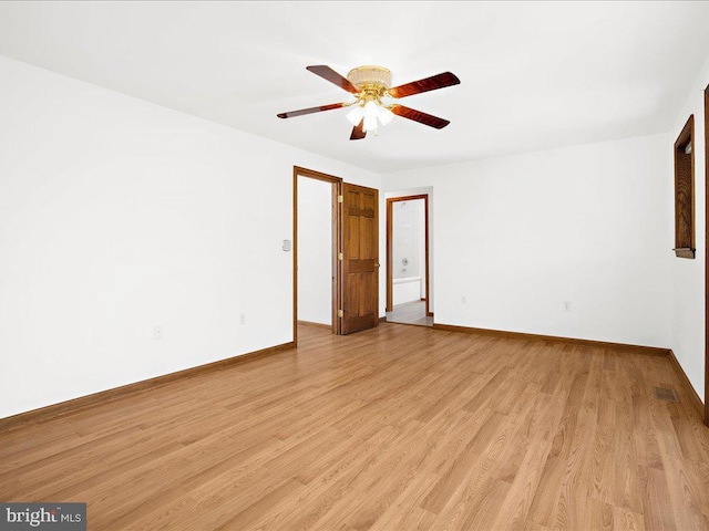 spare room with ceiling fan and light hardwood / wood-style floors