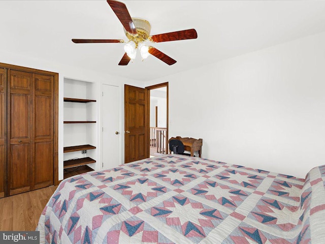 bedroom with ceiling fan and light wood-type flooring