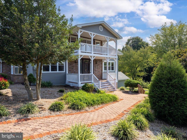 view of front facade with a porch and a balcony