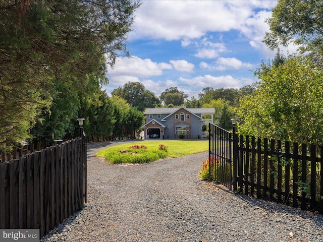 view of front of house with a front yard and a garage