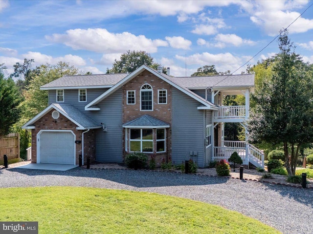 front of property featuring a front yard and a garage