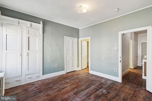 unfurnished bedroom featuring dark wood-type flooring