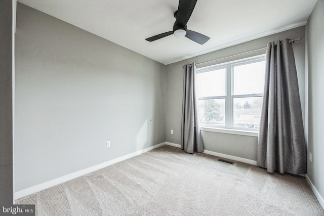 carpeted empty room with ceiling fan