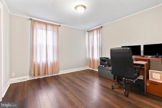 home office featuring a healthy amount of sunlight, wood-type flooring, and visible vents