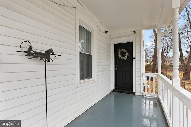 doorway to property featuring a porch