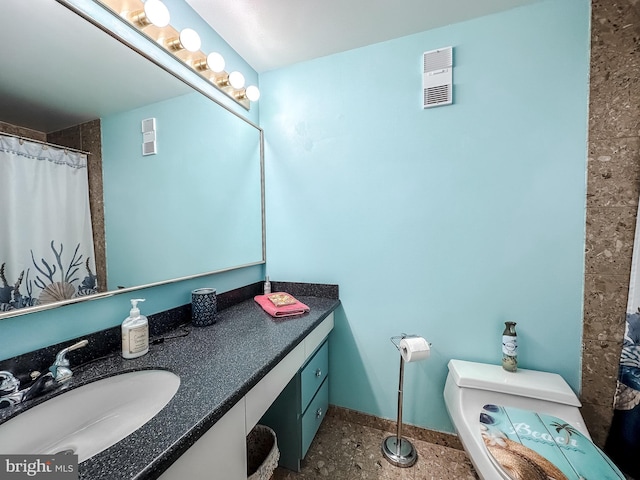 bathroom with vanity and toilet