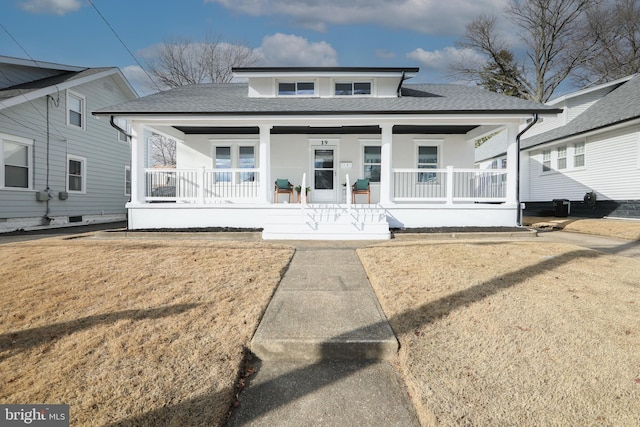 view of front of house with a front lawn and covered porch