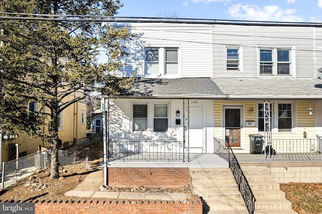 townhome / multi-family property featuring a porch