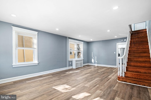 unfurnished living room with light hardwood / wood-style flooring