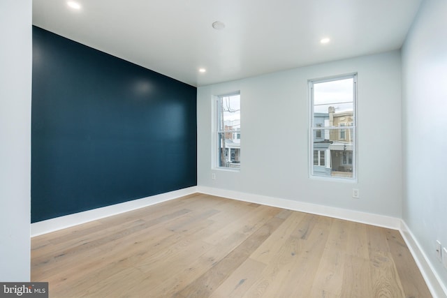 unfurnished room featuring light hardwood / wood-style flooring